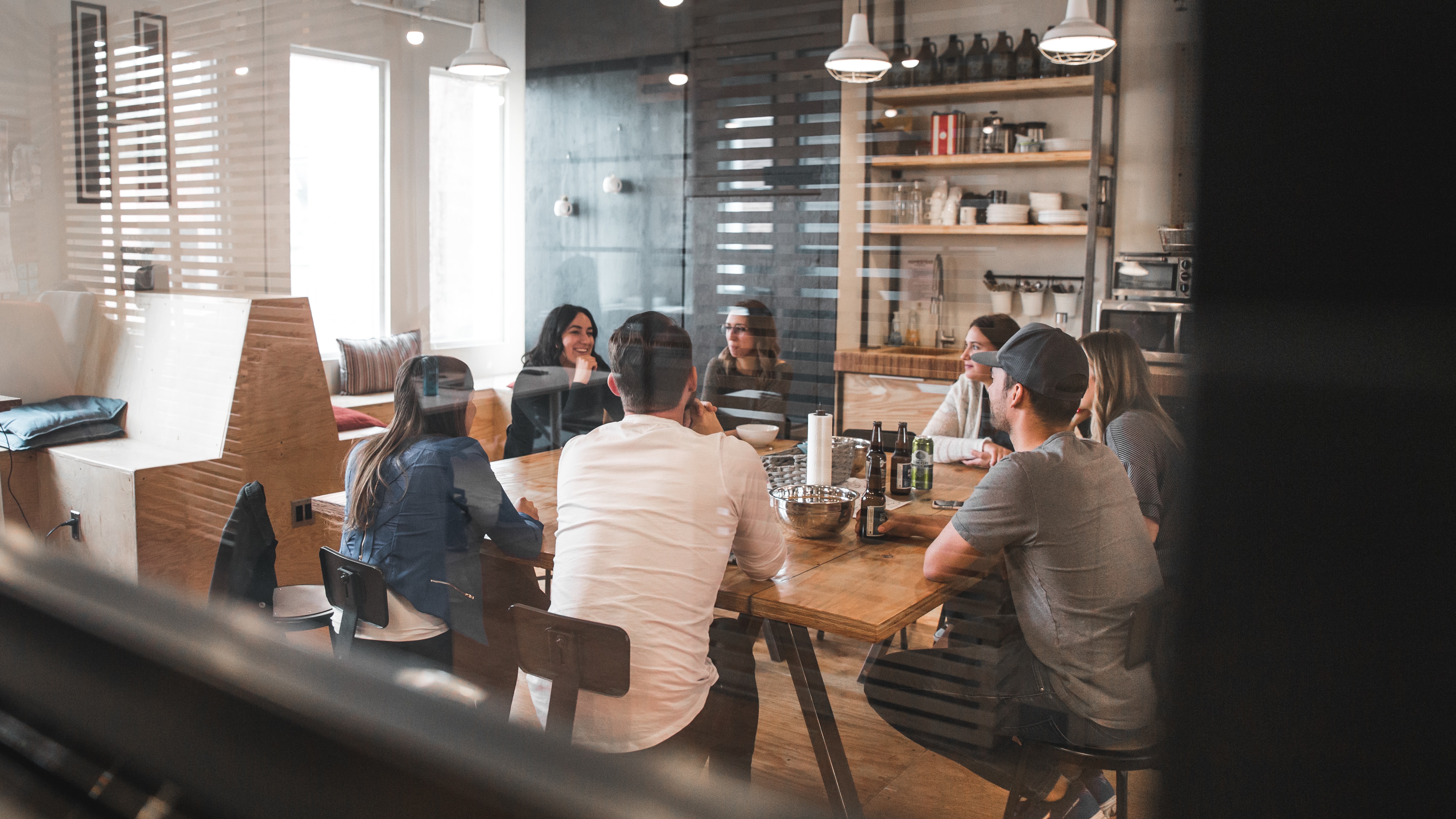 People in a glass meeting room